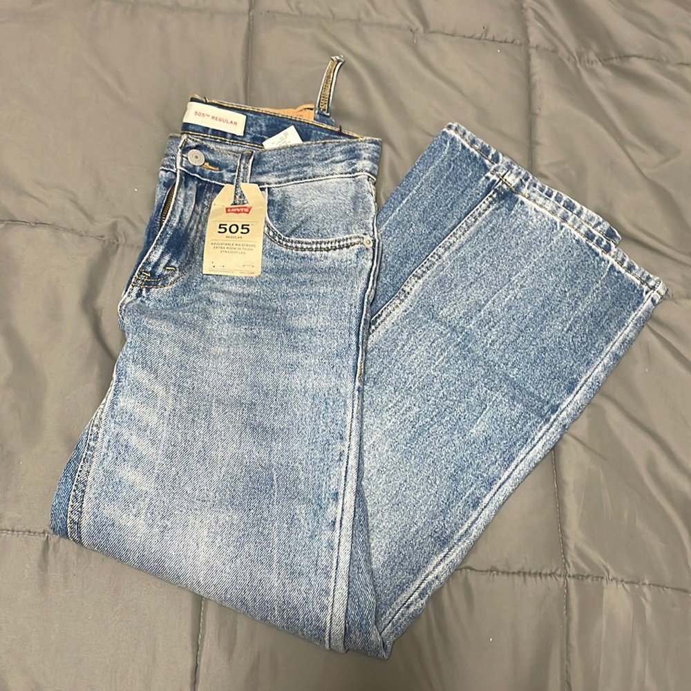 Levi’s 505 style light wash blue jeans